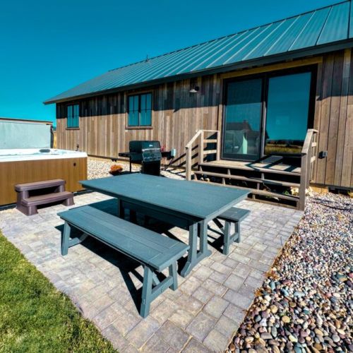 Relax on the back patio by soaking in the hot tub or cooking something up on the propane grill!