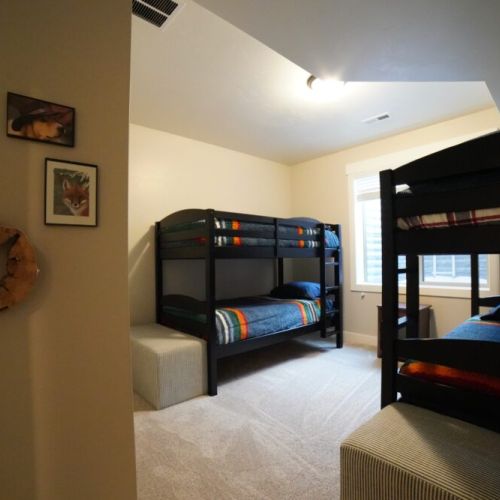 Bedroom #4, located in the basement, has two sets of twin-over-twin bunk beds — perfect for kids!
