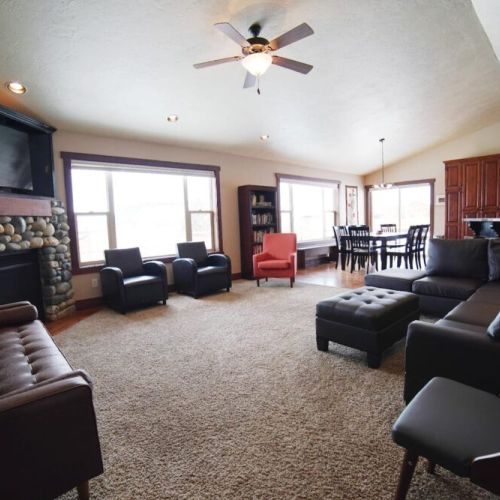 The spacious living room connects with the dining room and kitchen, making it an ideal space for spending time with friends and family.