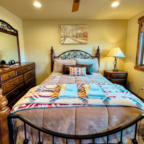 Bedroom #2 has a queen bed and an en suite bath — as well as a view of the Tetons.