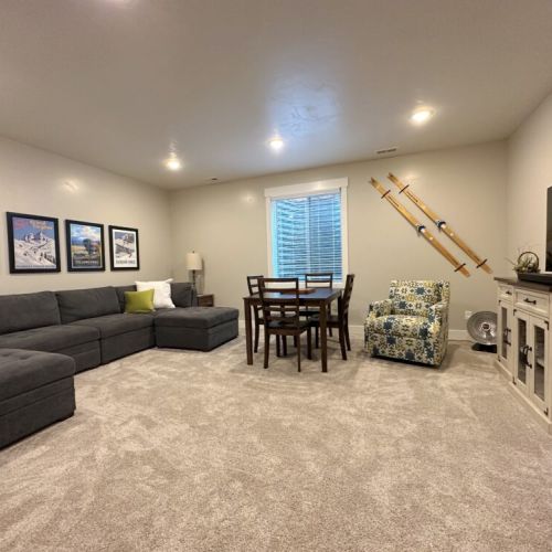 Head to the basement living area to lounge on the sectional and make use of the large smart TV.