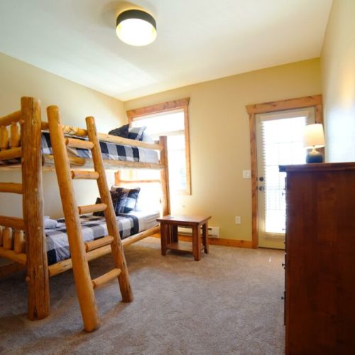 Bedroom #3 features a handmade twin-over-twin pine bunkbed — perfect for kids!