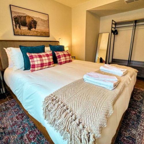 Bedroom #4 features a queen bed and a clothing organizer with plenty of room for all your belongings.