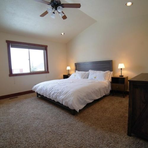 The master bedroom has a comfy king sized bed with all cotton bedding.