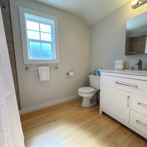 The upstairs full bathroom has a spacious vanity and tub/shower combo — bedroom #2 enjoys direct access to this bathroom!