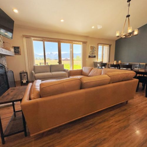 Kick back and relax in the living room, taking advantage of the cozy seating, a large TV, and an unbelievable view.