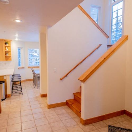 The kitchen and living room are on the main floor — sleeping areas are upstairs and downstairs.
