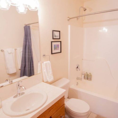 Bedroom #2 makes use of the upstairs hallway bathroom, which also enjoys a vanity and tub/shower combo.