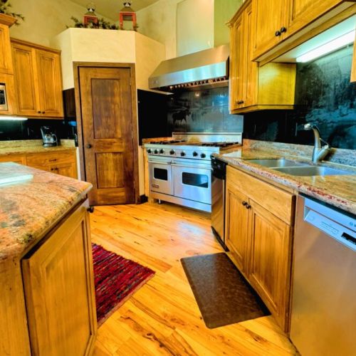 Cook gourmet meals in the fully equipped kitchen, then enjoy them in the elegant dining area with mountain charm.