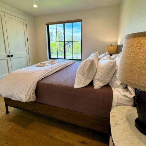 Bedroom #2 (ground floor) has a king bed, views of the front of the home, and its own en suite bathroom.