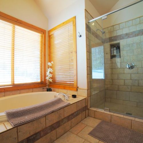 The master en suite has both a soaking tub and a walk-in shower.