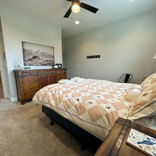 The master bedroom has a queen bed and an en suite bath.