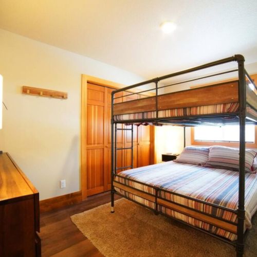 The other downstairs bedroom features a queen-over-queen bunk.
