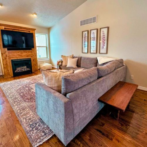Relax in the living room after a day of play by lounging on the sofa in front of the gas fireplace or smart TV.