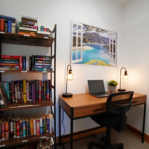 The workspace/library has a well-curated library and a desk for those that need to work- or school-from-home (laptop is not included).
