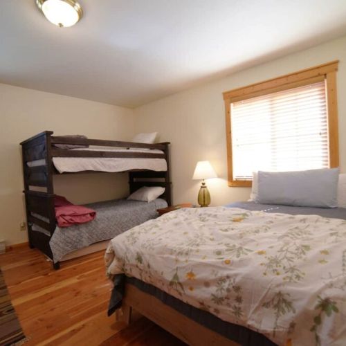 Bedroom #2 features a full bed and a twin-over-twin bunk.