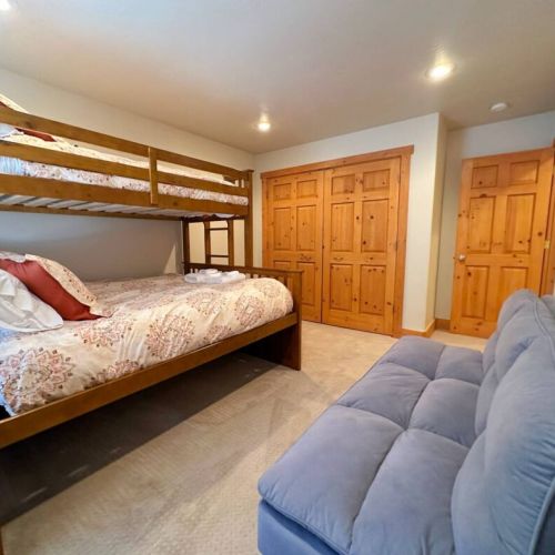 The downstairs bunk room enjoys a twin XL-over-queen bunk and a comfy futon. There is also a spacious closet to store your things!