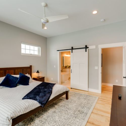 The primary bedroom features a king bed and a large en suite bathroom.