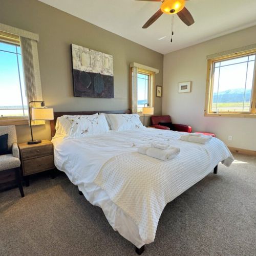 The master bedroom (located on the main level) features a king bed, an enormous en suite bathroom, and a beautiful view of the Tetons.
