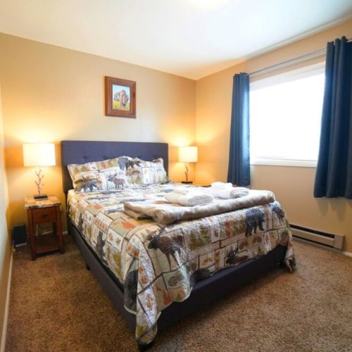 The second upstairs bedroom also has a queen bed and a large closet.