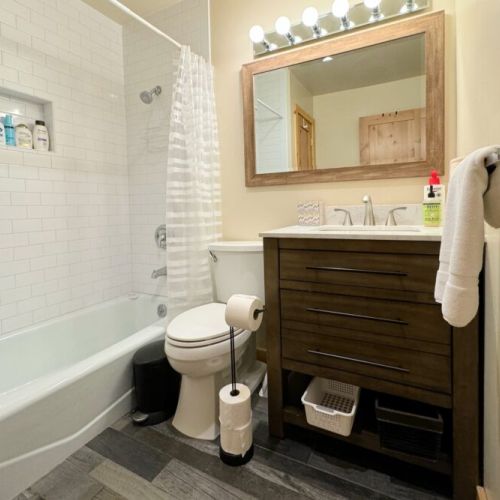 Bedrooms #2 and #3 share a full bathroom, which has a vanity and a tub/shower combo.
