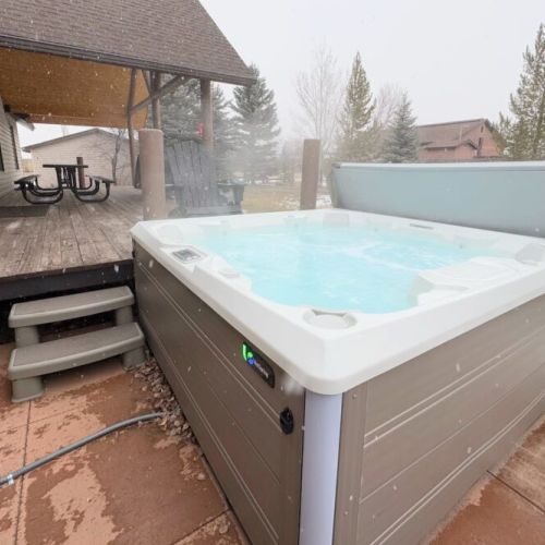 The private hot tub, located in the backyard, is a luxurious way to unwind after adventuring in the Tetons.