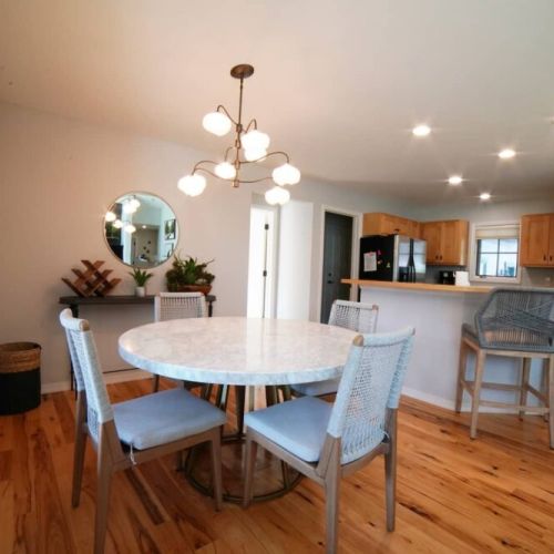 Gather around the dining table for food, conversation, or fun.