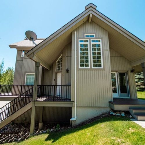 The townhome has two lovely outdoor spaces — sit out on the deck off the living room, or grill up a meal via the patio off the dining area. (Grill is available but not pictured.)
