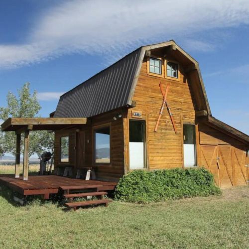 A large, covered deck welcomes you and wraps around to the hot tub.