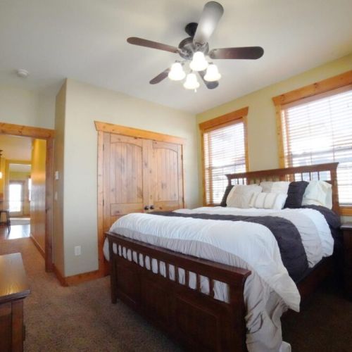 Bedroom #2 has a queen bed, large closet, and a door out to one of the condo's two balconies.