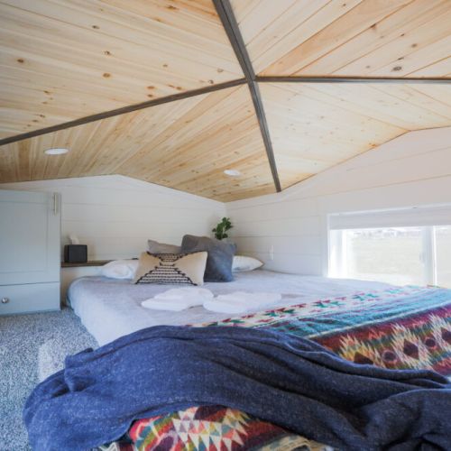 Doze off in this comfortable queen bed, located in the sleeping loft.