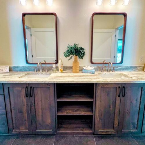 The Jack-and-Jill-style bathroom (shared by Bedrooms #2 and #3) features a double vanity and a tub/shower combo.