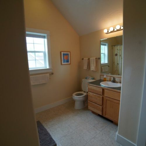 Upper bathroom has a combo shower tub and plenty of room for everyone.