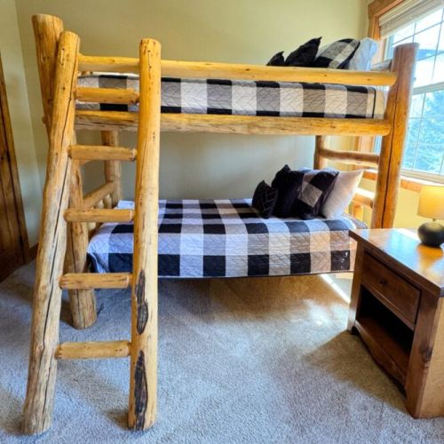Bedroom #3 features a handmade twin-over-twin pine bunkbed — perfect for kids!