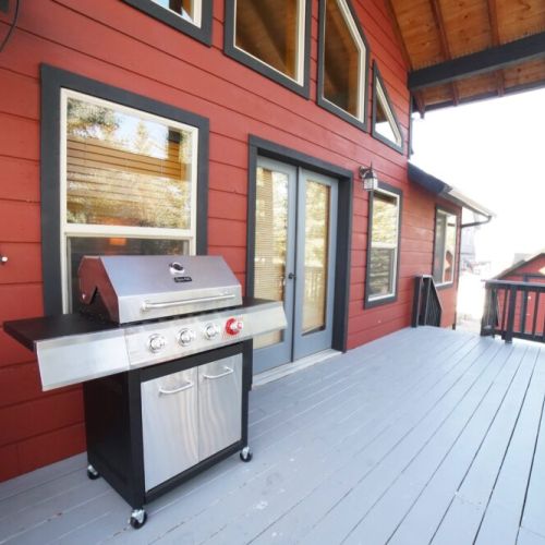 The back deck also features a propane grill — perfect for family meals!