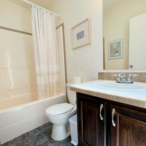Bedrooms #2 and #3 share a full bathroom, which enjoys a vanity and tub/shower combo.