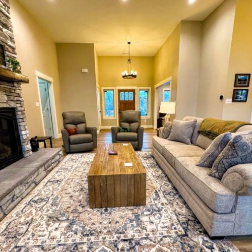Relax in the living room after a day of play by lounging on the sofa or recliners in front of the gas fireplace or smart TV.