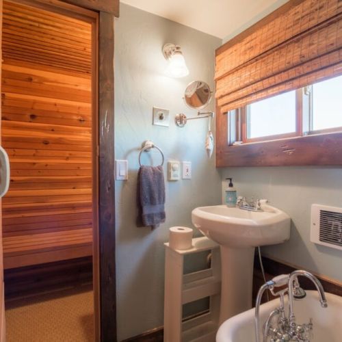 The en suite bathroom enjoys a lovely tub and direct access to the sauna.