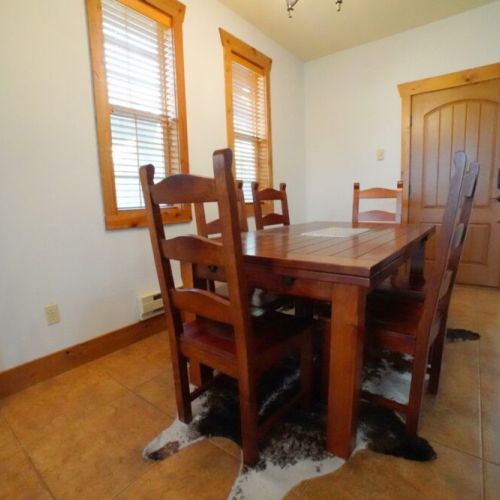 Sit down at the dining room table for food, games, or conversation!