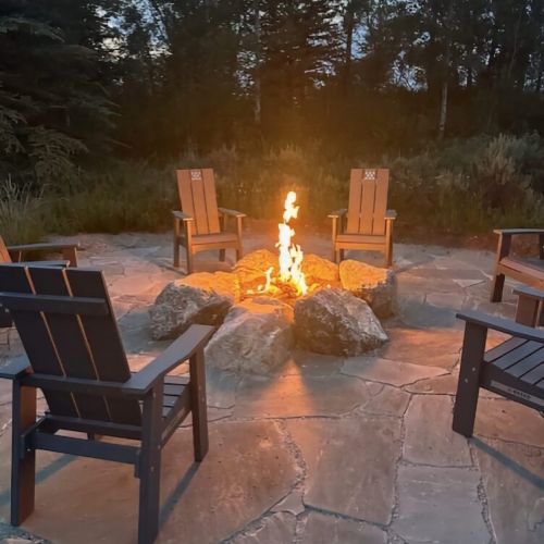The outdoor fire pit offers a cozy, relaxing option for unwinding.