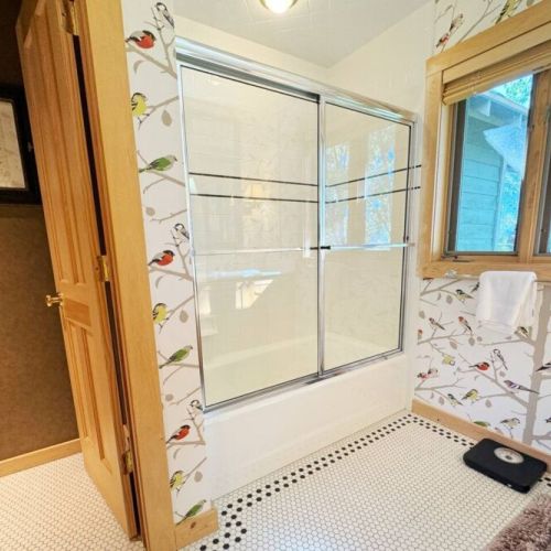 The master bedroom has a king bed, lovely sitting space,  a walk-in closet, and an en suite bath.