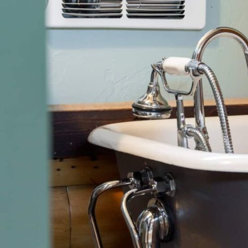 The en suite bathroom enjoys a lovely tub and direct access to the sauna.