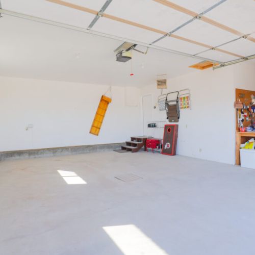 This spacious garage comes with plenty of space for your vehicles and gear.