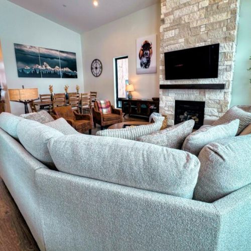 Kick back and relax in the living room, taking advantage of the inviting seating, a large TV, and a cozy gas fireplace.
