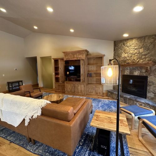 Kick back and relax in the living room, taking advantage of the cozy seating, a large TV, and a gas fireplace.