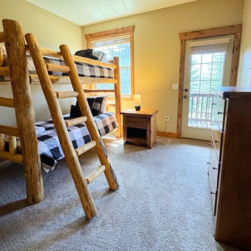 Bedroom #3 features a handmade twin-over-twin pine bunkbed — perfect for kids!