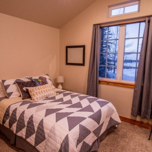 Bedroom #2 has a queen bed and plenty of storage!