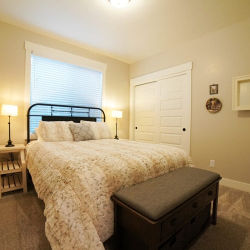 Bedroom #3, located in the basement, enjoys a queen bed and large closet.
