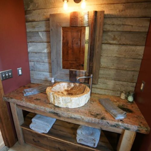 More one of a kind petrified sinks in master bath.