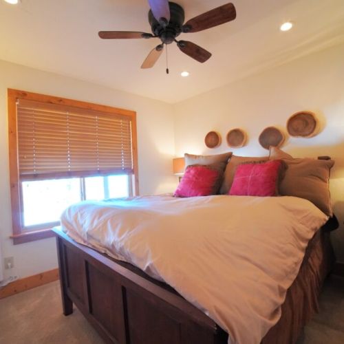 Bedroom #4 is also located in the basement and features a queen bed.